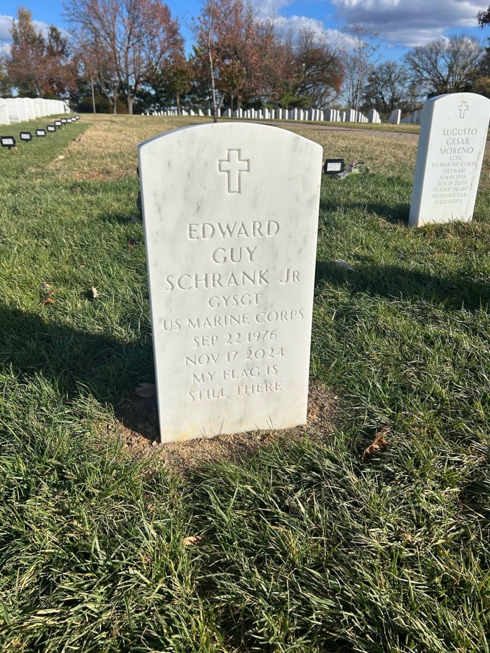 Headstone of Edward Guy Schrank Jr, US Marine Corps. Inscription: MY FLAG IS STILL THERE